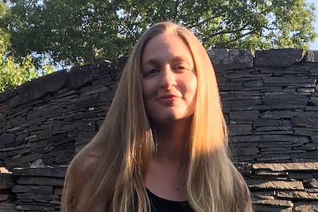 A white woman with long blonde hair